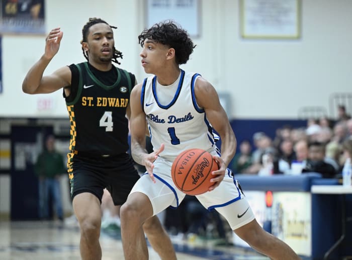 Quinn Barnett of Brunswick looks to make a pass around a defender in a district final win over St. Edward on March 9, 2024.